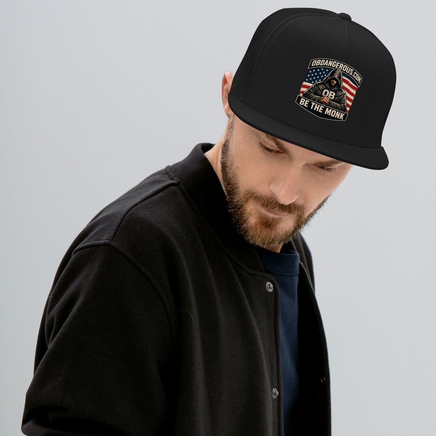 Black OB DANGEROUS Be The Monk embroidered trucker cap with 5-panel design, suitable for gym, street, and casual wear.