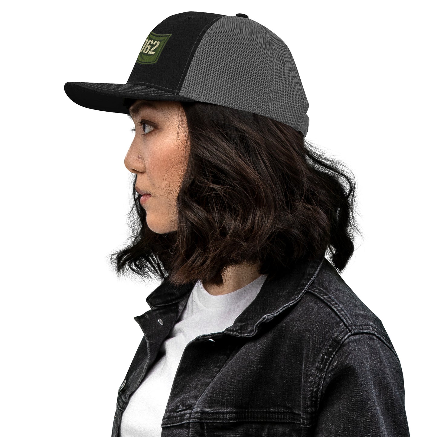 Black OB DANGEROUS OBD62 Trucker Cap with embroidered logo, snapback style, shown from left side view.