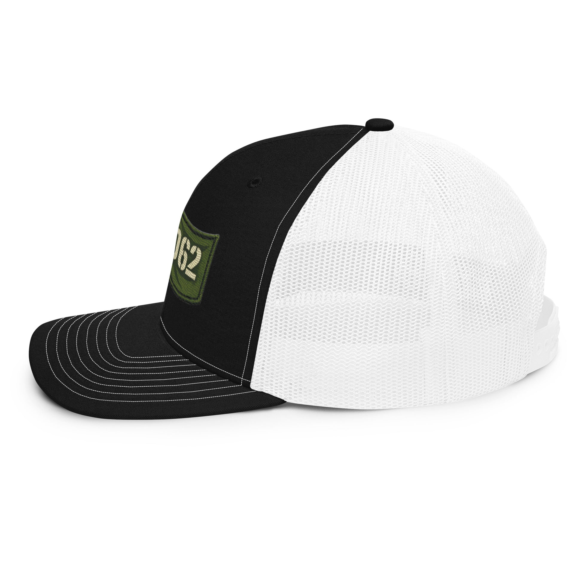 Black and white OB DANGEROUS embroidered trucker cap with snapback closure, viewed from the left side.