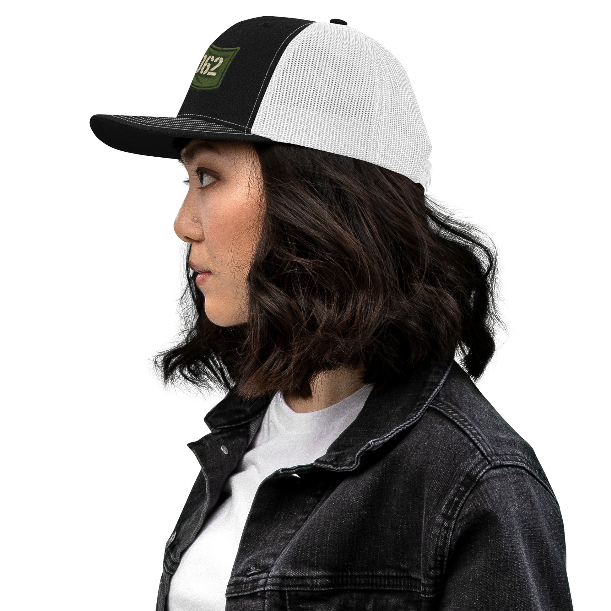 Black and white OB DANGERO OBD62 Trucker Cap with embroidered logo, snapback style, shown from the left side.