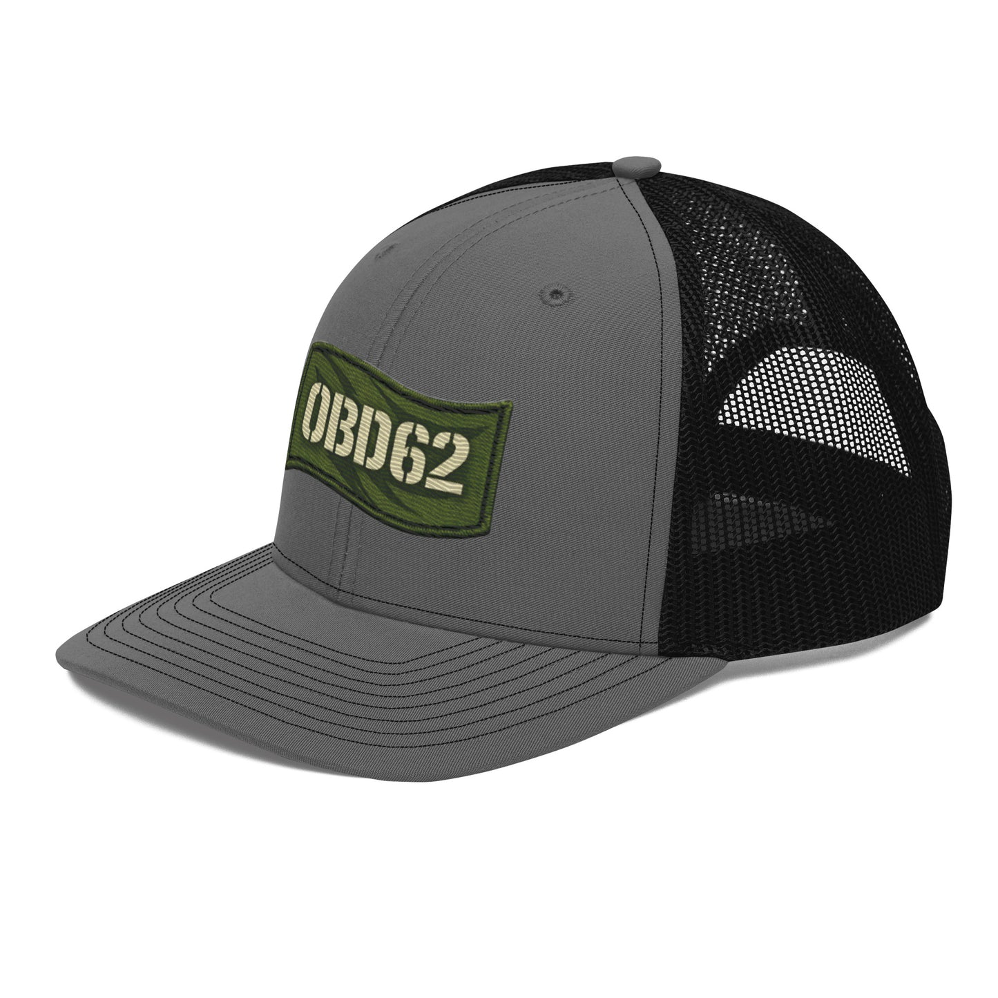 Charcoal black OB DANGEROUS OBD62 trucker cap with embroidered logo, snapback closure, worn on a model's head from the front left view.