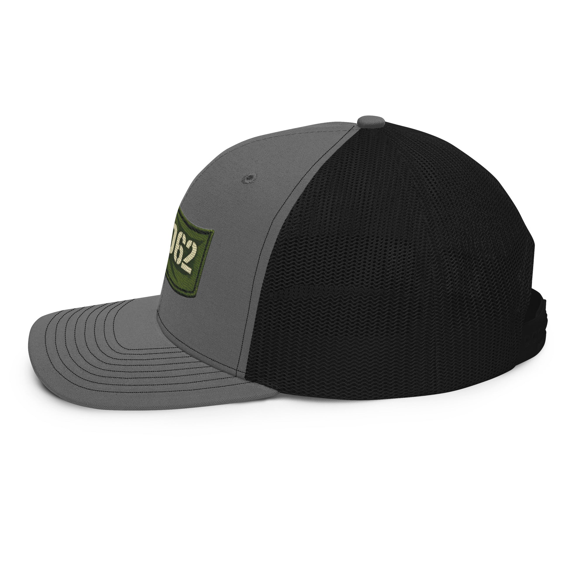 Charcoal black OB DANGEROUS OBD62 trucker cap with embroidered logo, viewed from the left side, casual streetwear style.