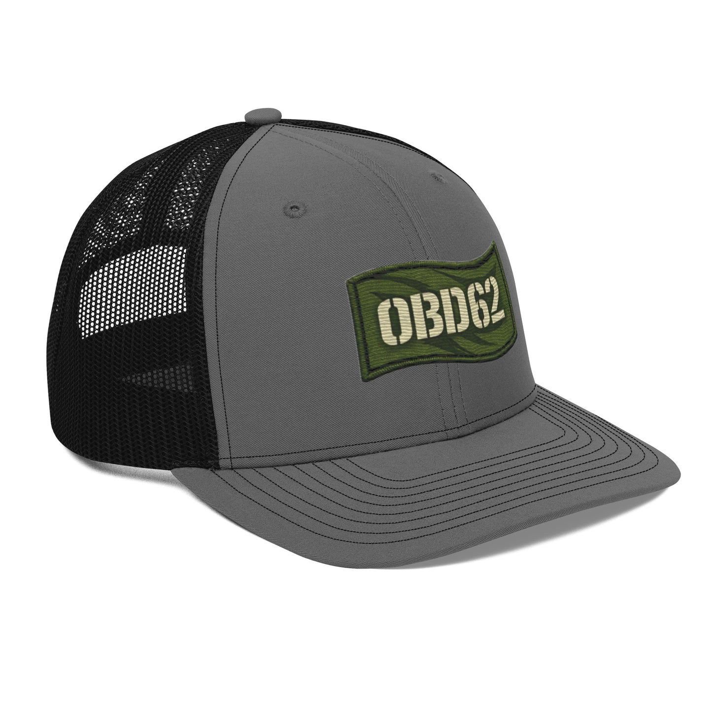Charcoal black OB DANGEROUS OBD62 trucker cap with embroidered logo, snapback style, worn on the right front.