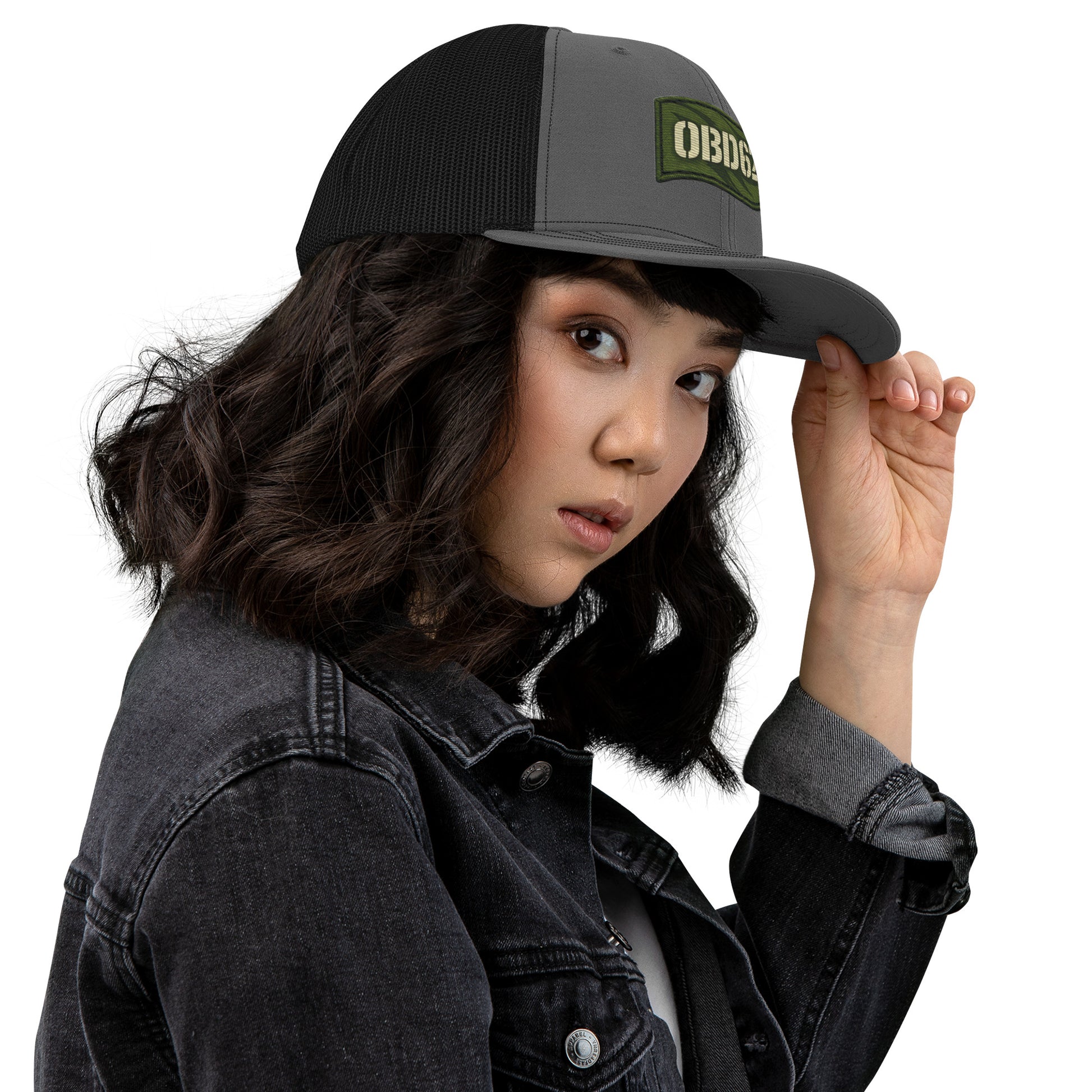 Charcoal black OB DANGEROUS OBD62 trucker cap with embroidered design, viewed from the right side, casual street and gym style.