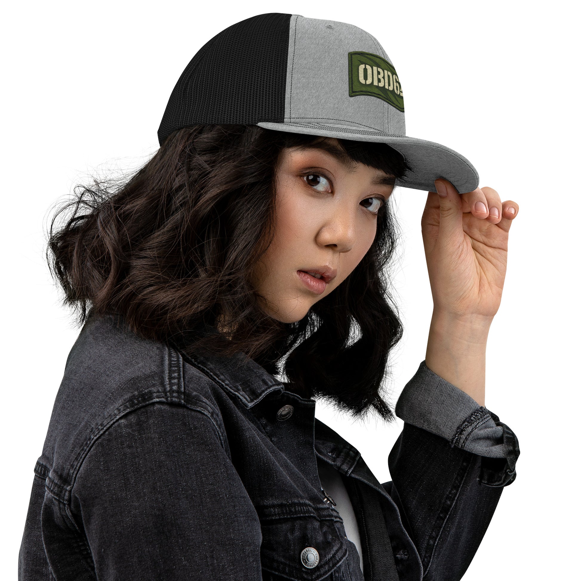 OB DANGEROUS embroidered trucker cap in heather grey and black, snapback style, with side embroidery detail.